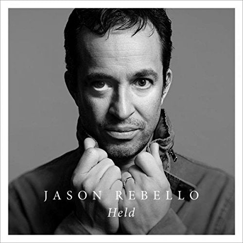 Black and white album cover featuring a man with dark hair and a contemplative expression.