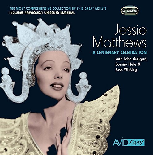 "CD cover featuring a woman in ornate costume and headdress against a dark background."