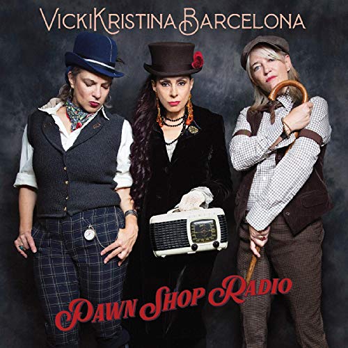 "Three women in vintage attire posing with a radio and cane against a dark background."