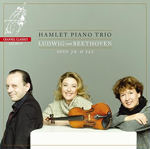 "CD cover with three musicians and a violin on a table."