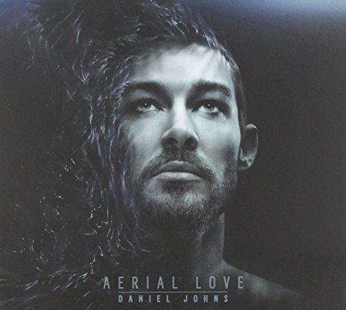 CD cover featuring a close-up portrait of Daniel Johns with flowing dark shapes.
