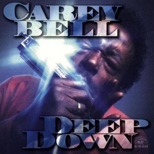 "Album cover featuring a man playing a harmonica, with title and artist name."