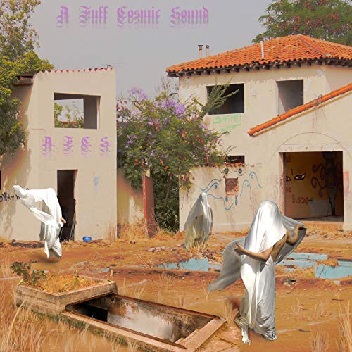 Album cover with figures draped in white fabric near weathered buildings.