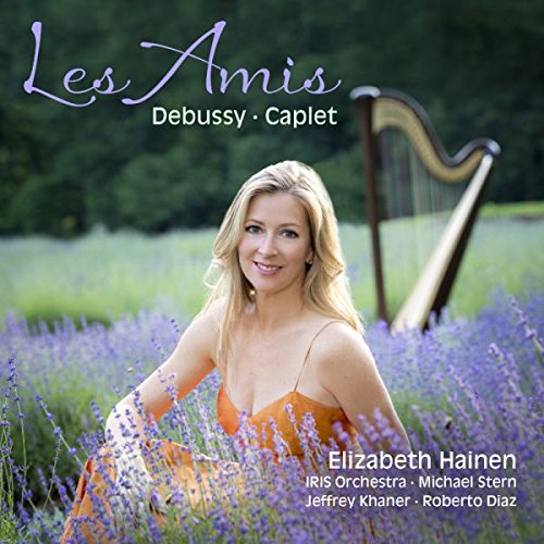 "CD cover featuring a blonde woman in an orange dress among lavender flowers with a harp."