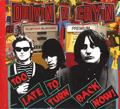 "Album cover with three men and colorful background, titled 'Drivin N Cryin'."