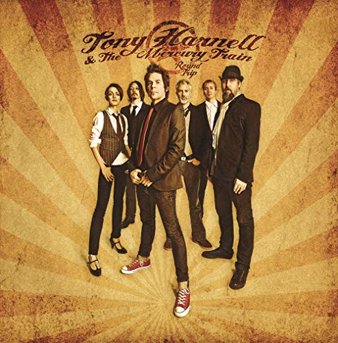 Band portrait of Tony Harnell & The Mercury Train on a sunburst background.