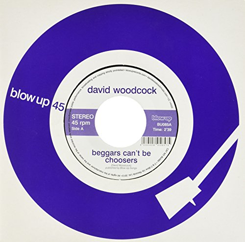 A purple 45 rpm vinyl record with a white center label featuring text details.