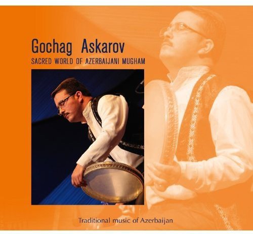 CD cover with a man playing a drum on an orange background.