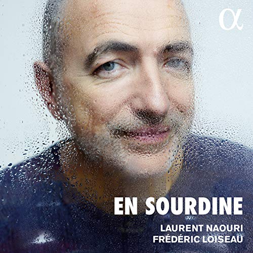 "Album cover with a man behind a wet glass, text 'En Sourdine'."