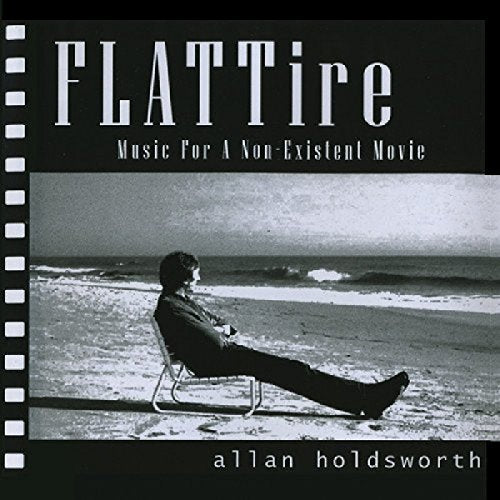 CD cover showing a man sitting on a beach chair facing the ocean.