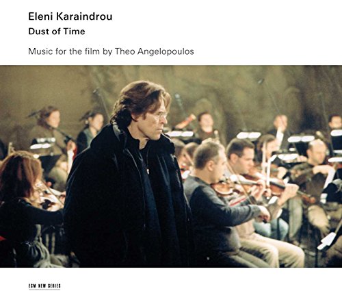 "Eleni Karaindrou's 'Dust of Time' CD cover featuring a man standing before an orchestra."