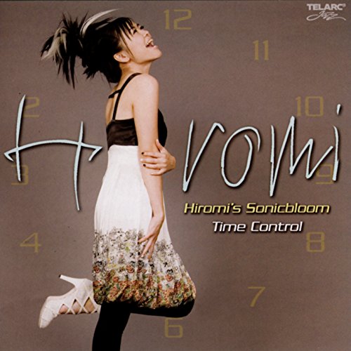 "Album cover featuring a woman in a white skirt and black top."