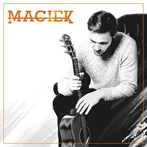 "Album cover featuring a man playing an acoustic guitar in black and white."