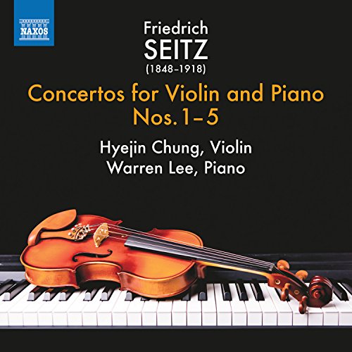 "CD cover featuring a violin on piano keys against a black background."