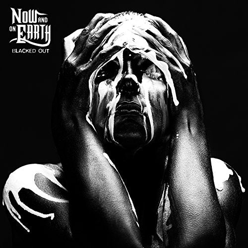 Album cover with a person covered in white paint, hands on their face, against a black background.