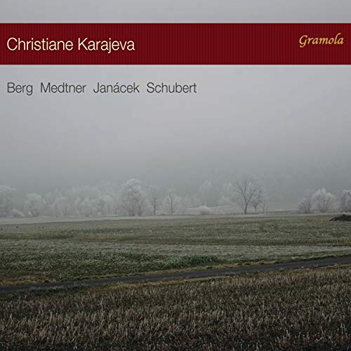 "CD cover with frosty landscape and red banner featuring artist and composer names."