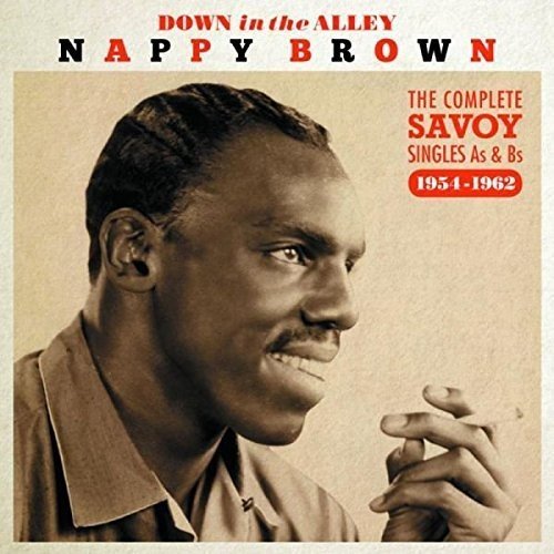 A sepia-toned album cover featuring a man with clasped hands.
