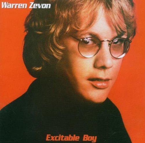 Warren Zevon album cover featuring a man with glasses and red background.