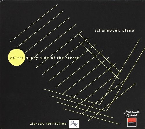 Dark green album cover with yellow lines and text, featuring "Tchangodei, piano" and yellow circle.