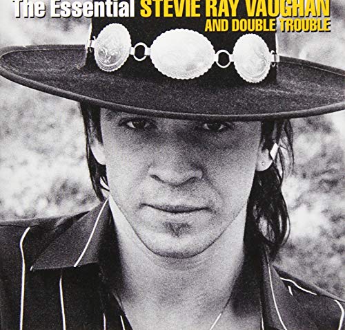 BlackLblack and white portrait of Stevie Ray Vaughan wearing a wide-brimmed decorated hat.