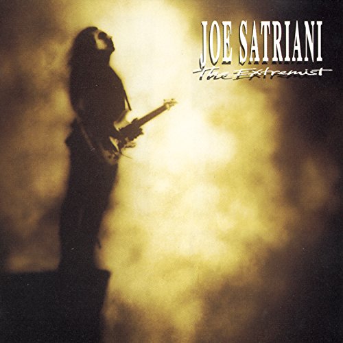 Joe Satriani album cover, silhouetted guitarist against a hazy yellow background.