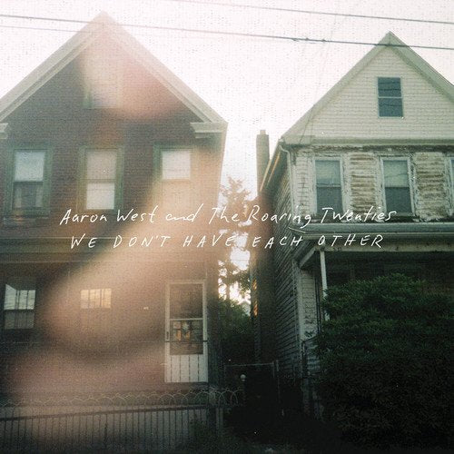 "Album cover featuring two old houses with text overlay."