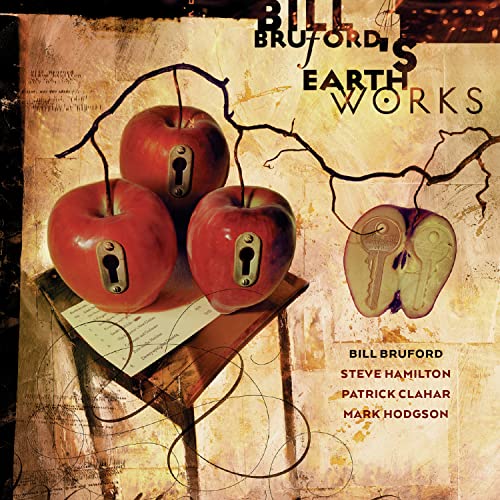 CD cover: red apples with keyholes, a key, and sheet music.