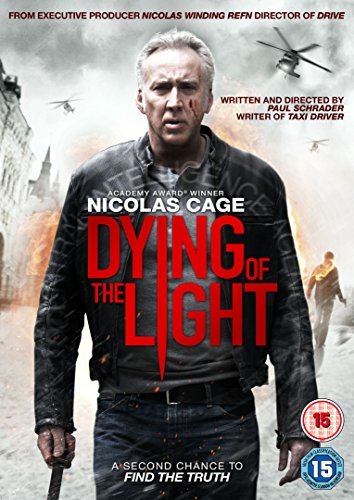 DVD cover for "Dying of the Light" featuring Nicolas Cage, bloodied and determined.