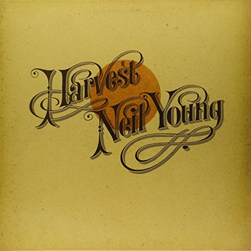Neil Young’s “Harvest” vinyl record cover, yellow background, ornate lettering.