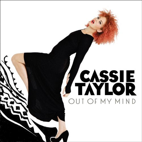 Album cover featuring a woman in a black dress with red curly hair.