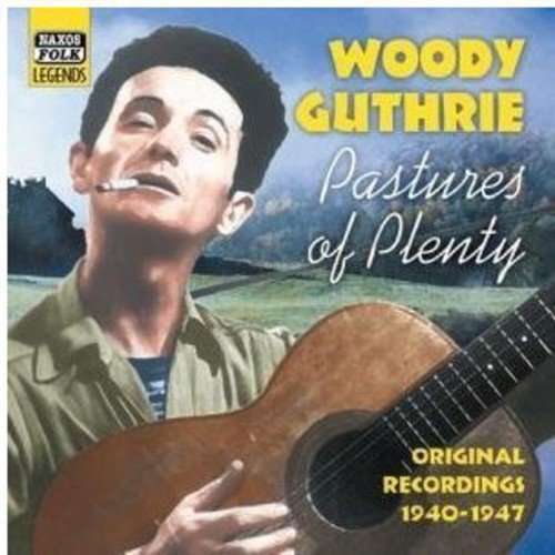 "Album cover featuring Woody Guthrie holding a guitar, with a green landscape background."