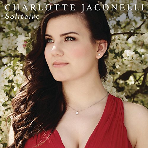 "Album cover featuring a woman in red dress surrounded by white flowers."