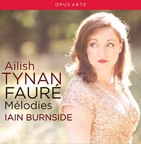 A woman with red hair and a floral top on a CD cover.