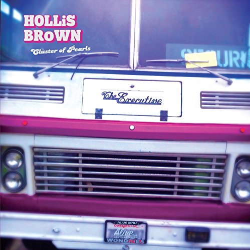 A vinyl album cover featuring the front of a white and red bus.