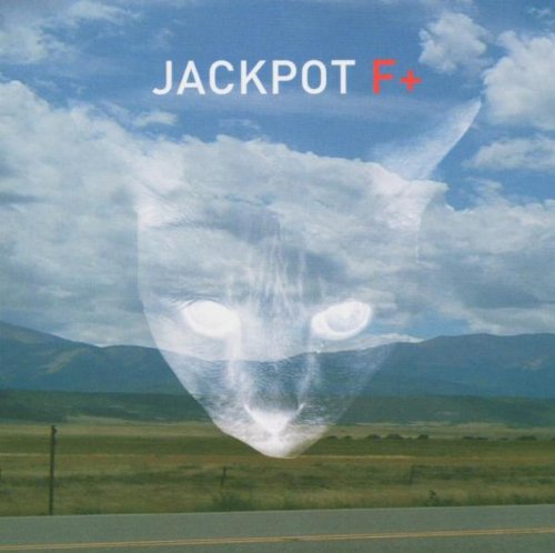 A cat's face is superimposed over a landscape with mountains and cloudy sky.