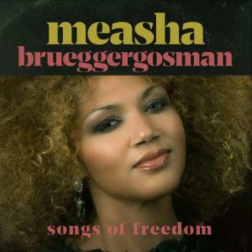 "CD cover featuring a woman with curly hair and the title 'Songs of Freedom'."
