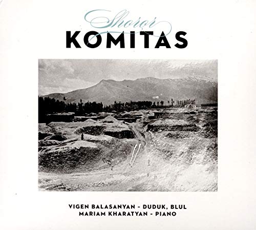 "CD cover with black and white landscape image and artist names."