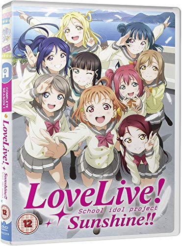 DVD cover featuring nine anime girls in school uniforms with a seaside background.