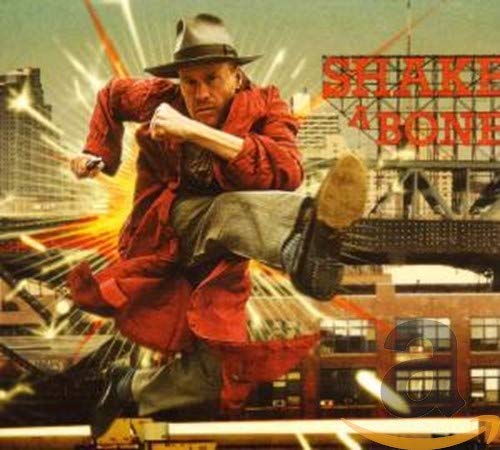 Man in hat and red coat kicking in front of city skyline.