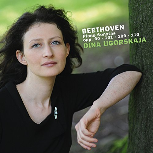 CD cover featuring a woman leaning against a tree, wearing a black top.