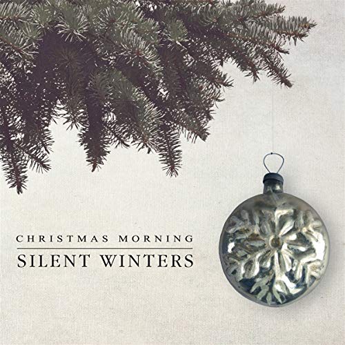 CD cover with evergreen branches and a silver ornament.