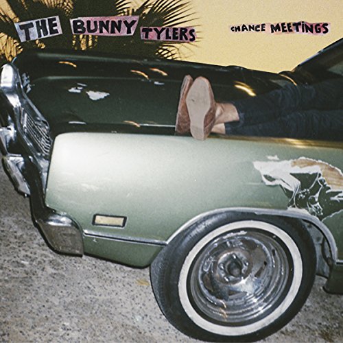Album cover: green car hood with legs and feet resting on it.