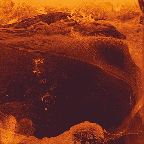 The image shows a close-up of a dark, abstract, orange-tinted surface. For accessibility purposes, a suitable alt text could be: "Dark, abstract, orange-tinted surface with textured, irregular patterns."