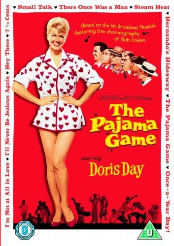 Doris Day wearing heart-patterned pajamas on a red movie poster for The Pajama Game.