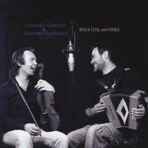"Album cover featuring two men playing violin and accordion in a recording studio."