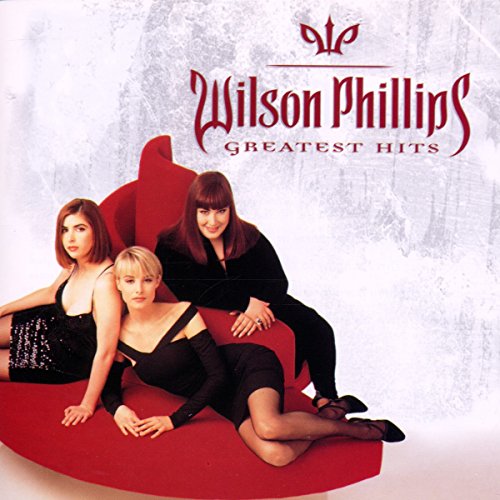 Wilson Phillips “Greatest Hits” CD cover with the trio on a red couch.