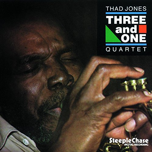 "Album cover of Thad Jones Quartet, featuring a man playing a trumpet, with text overlay."