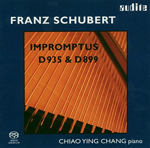 Dark blue album cover with piano keys image and white and black text.