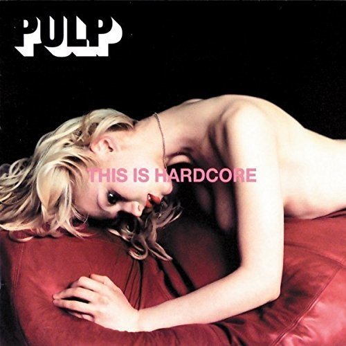 Album cover of "This Is Hardcore" by Pulp, featuring a topless blonde woman on red fabric.