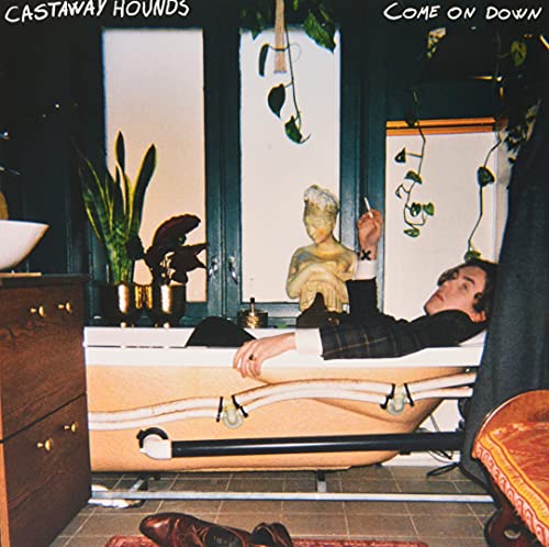 Album cover: person in bathtub, statue, plants, and window in background.